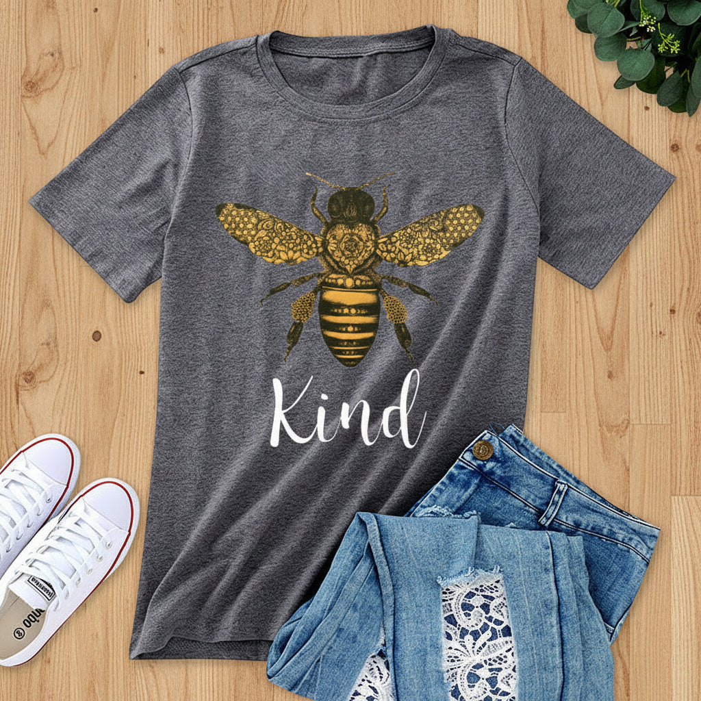 Gray t-shirt with bee graphic and 'Kind' text, paired with jeans and sneakers on a white background.