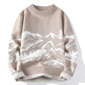 Beige sweater with mountain and tree design on a white background